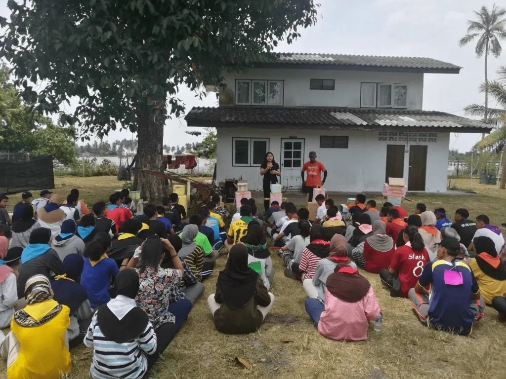 Suphaphit Chaiyadit holding morning assembly at a rural school.