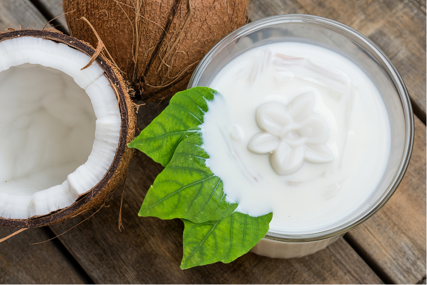 coconut milk jelly served in coconut milk next to a coconut
