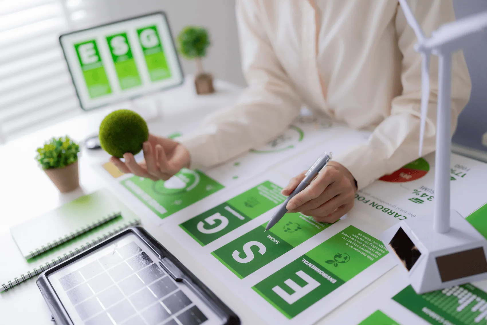 a person working on an ESG presentation deck
