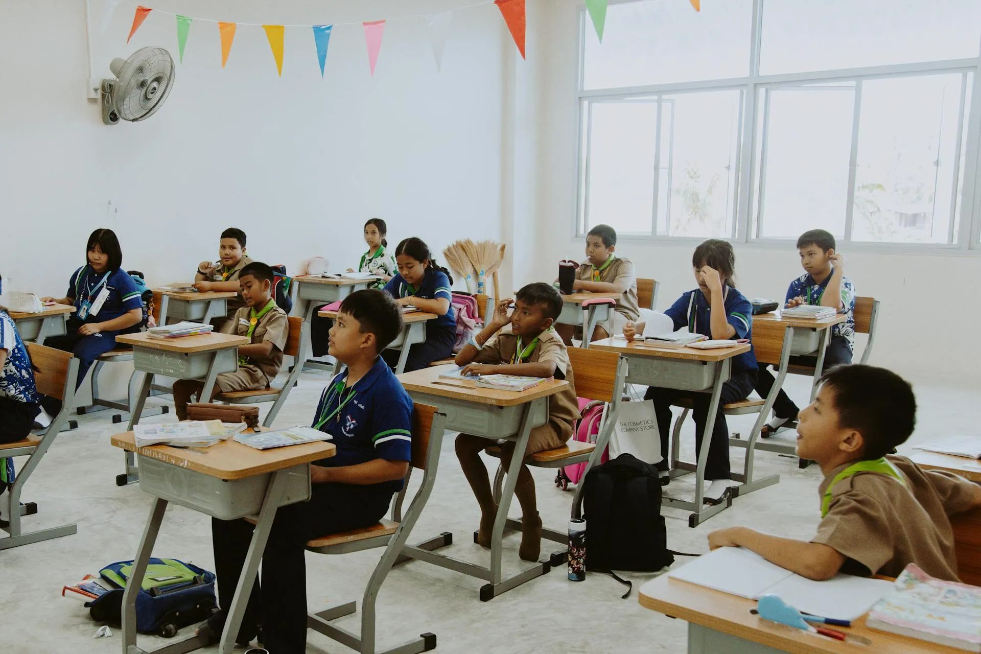 students in a big white classroom