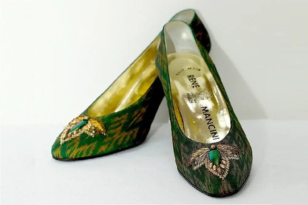 A royal pair of shoes created using beetle wing art.