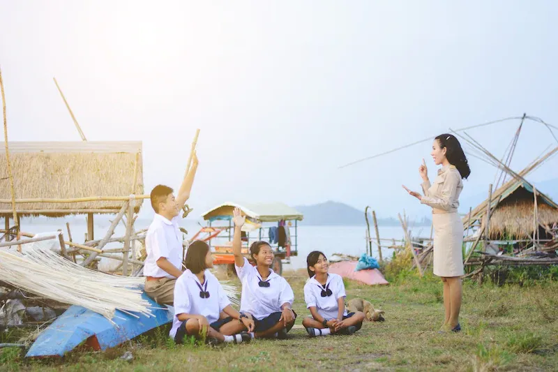 Rural school students attend class at their village.