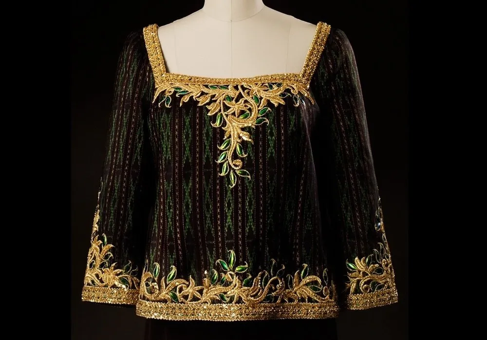 A royal top created using beetle wing art, with regal designs and intricate detail. 