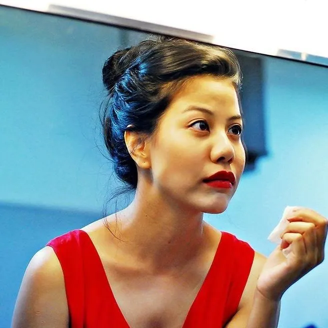Bua preparing for a performance at Thai Cultural Festival in 2014.