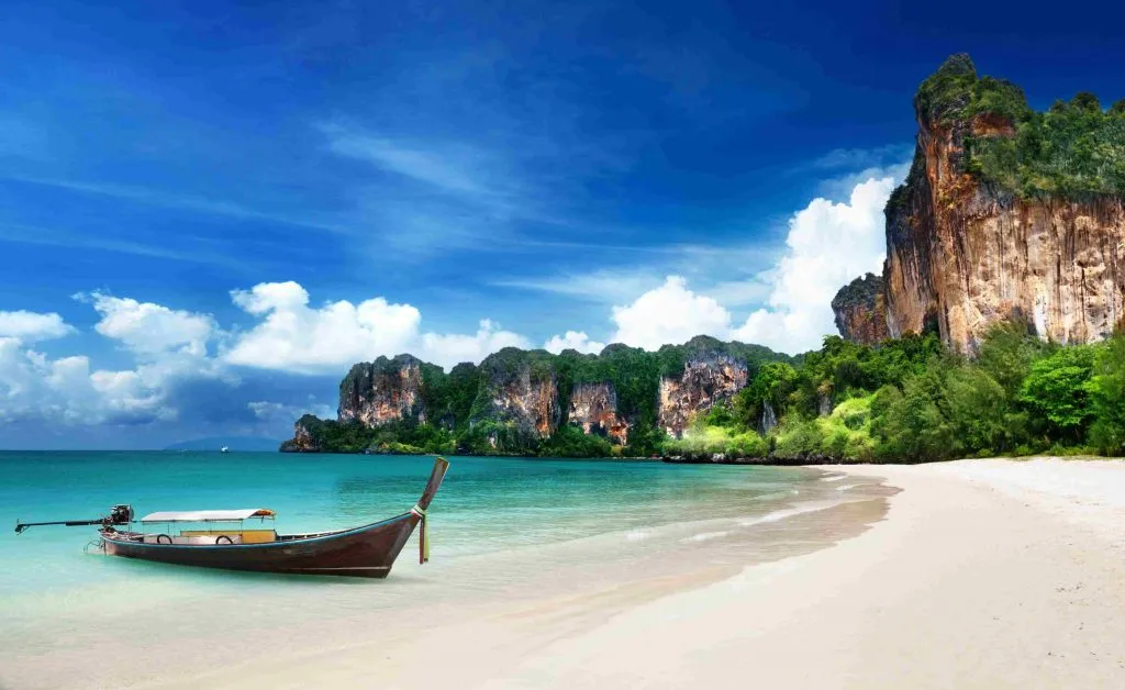 White sandy beaches framed by with limestone karsts.