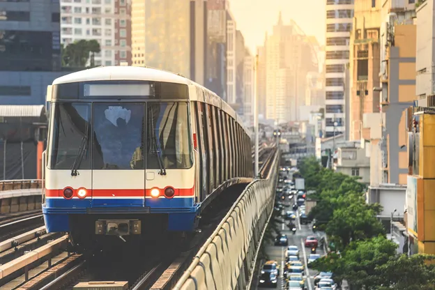 Bangkok's BTS Skytrain system is located above roads and runs through Bangkok's commercial districts.