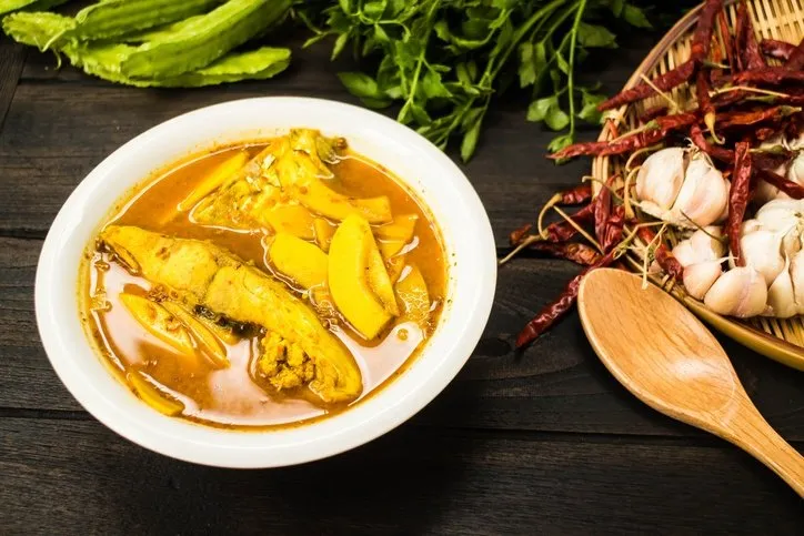 Thai yellow sour curry with fish.