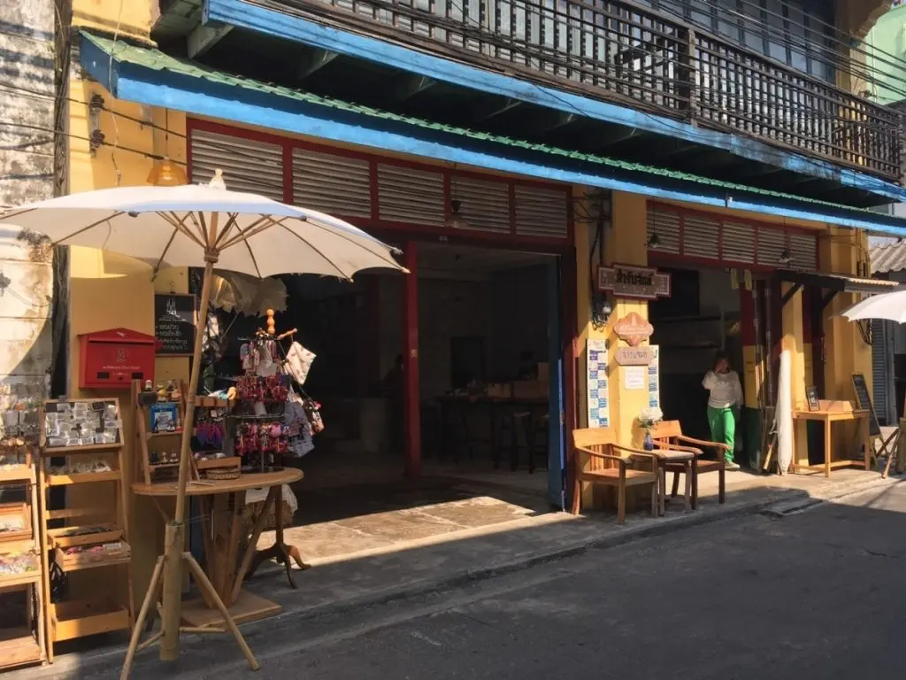 The outside of a local shop selling items such as umbrellas and traditional Thai goods.