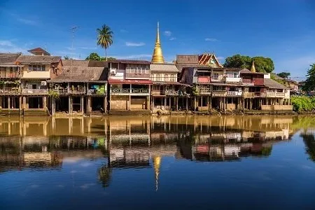 A series of low-rise wooden houses and colonial era-style buildings.