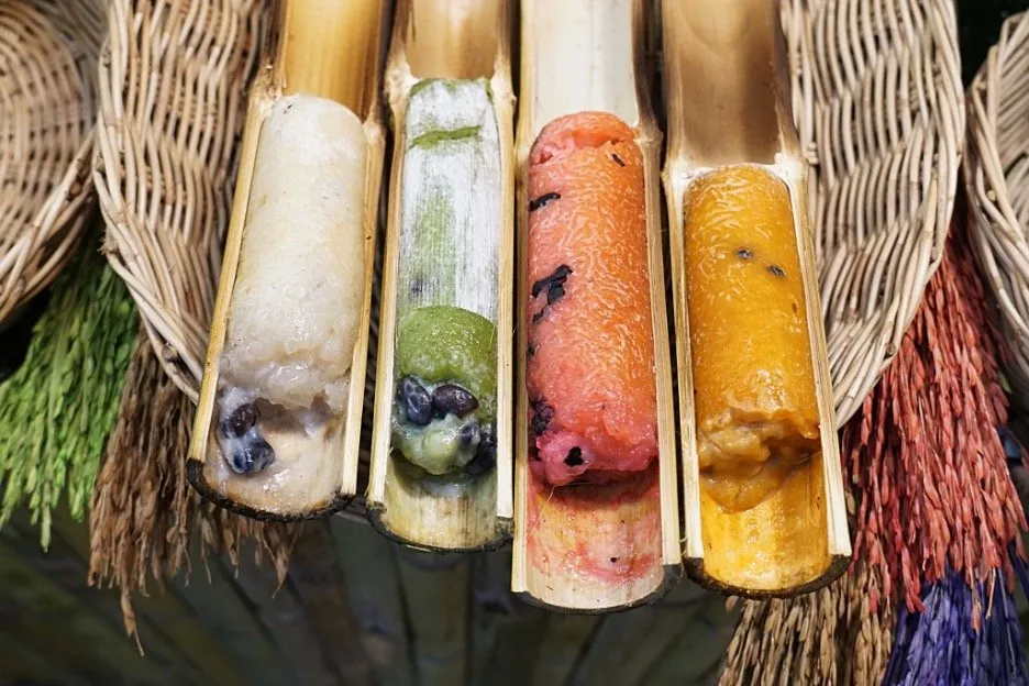 Khao Lam: charcoal rosated sticky rice and red beans stuffed in bamboo stalk.