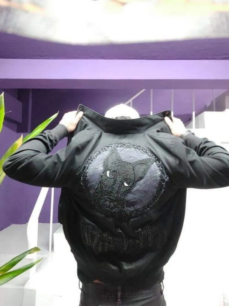 A jacket with a wolf sewing detail.