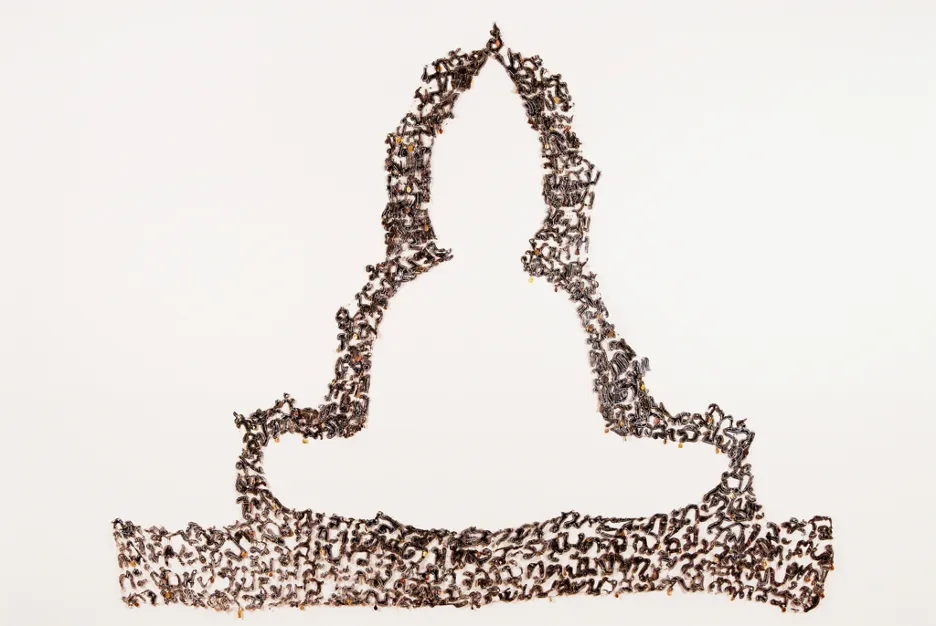 A silhouette of a Buddha statue with Thai alphabets pattern.