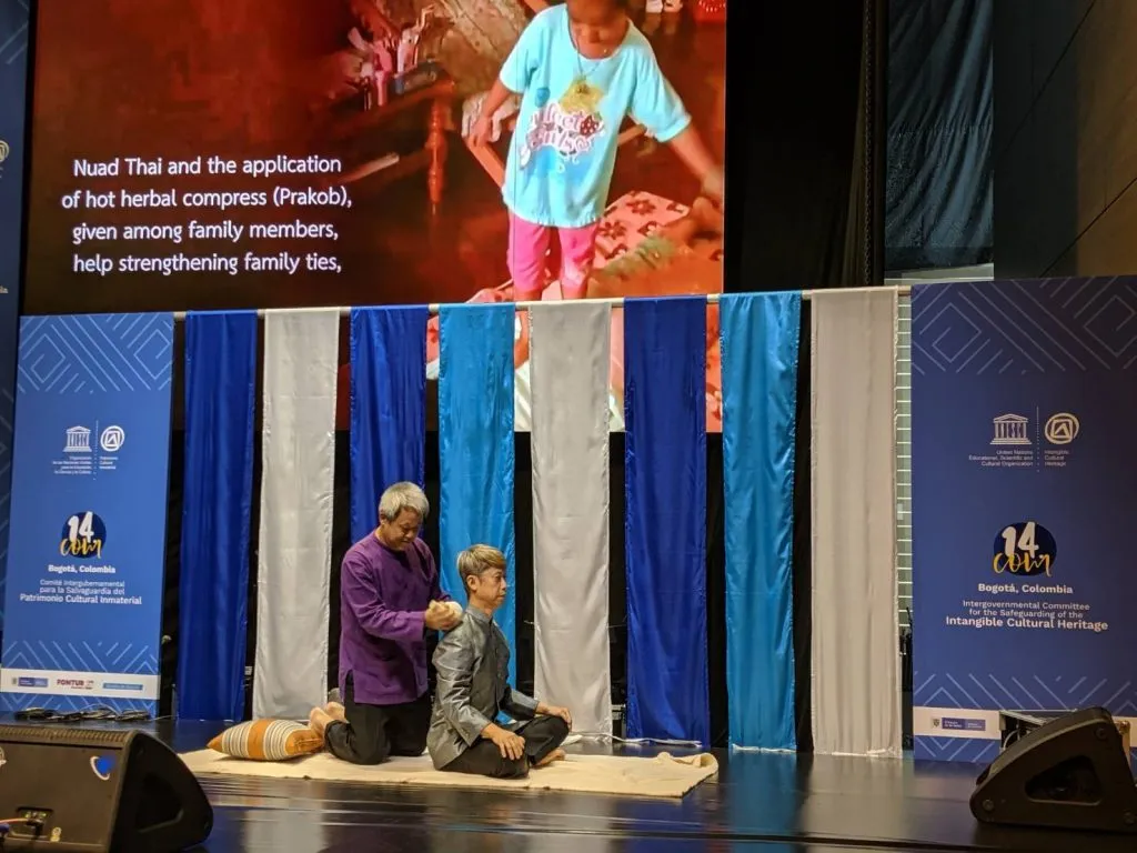 A man demonstrating the traditional Thai Massage in the fourteenth session of the Intergovernmental Committee for the Safeguarding of the Intangible Cultural Heritage.