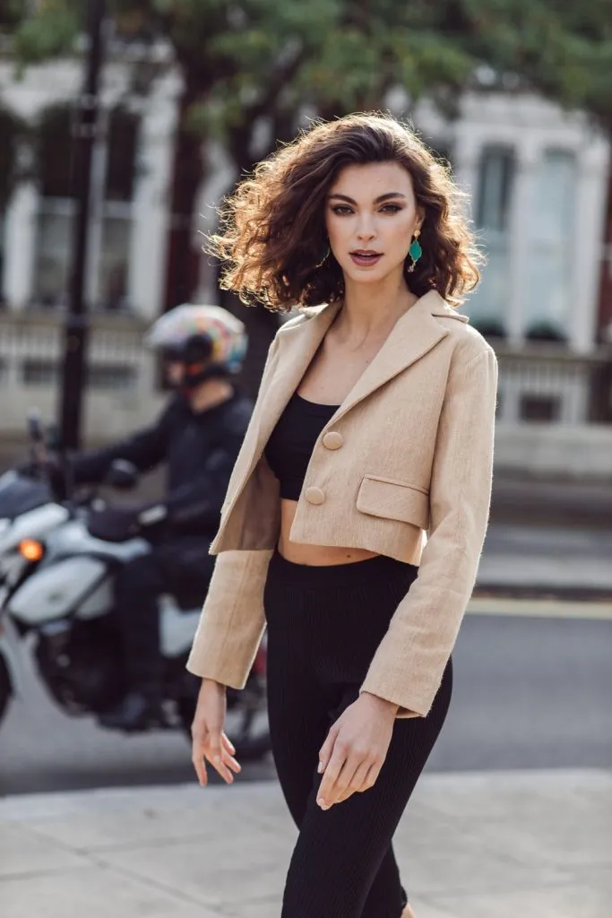 A model wearing a blazer made of Thai Textiles.