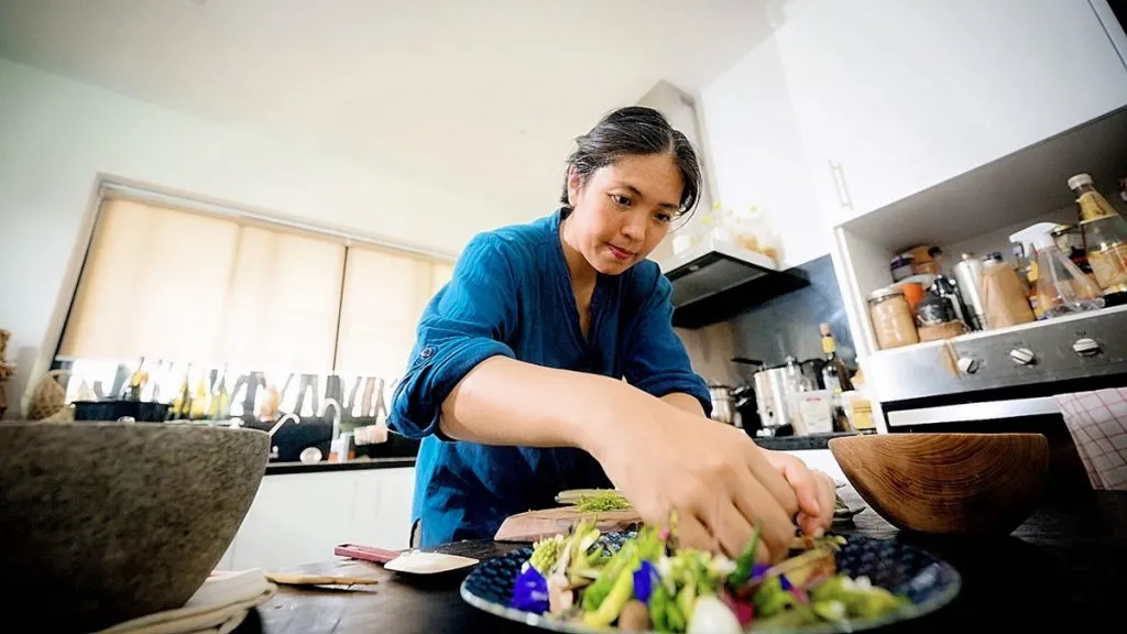 Bo Songsivara is preparing food that are made of organic and sustainably harvested produce.