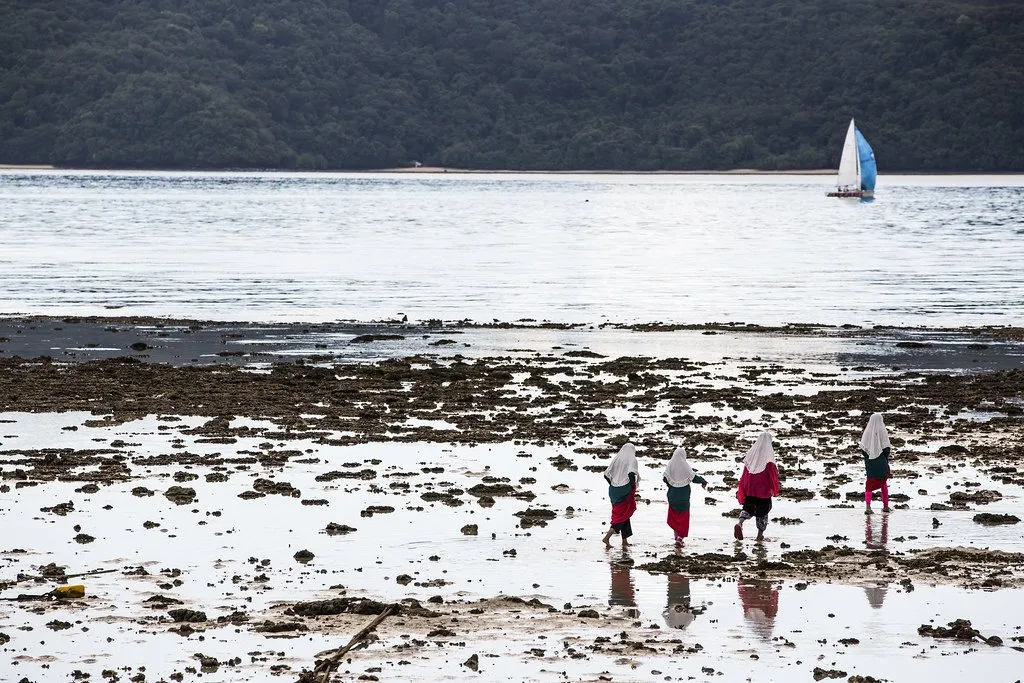 People walking on the beach at Laem Panwa