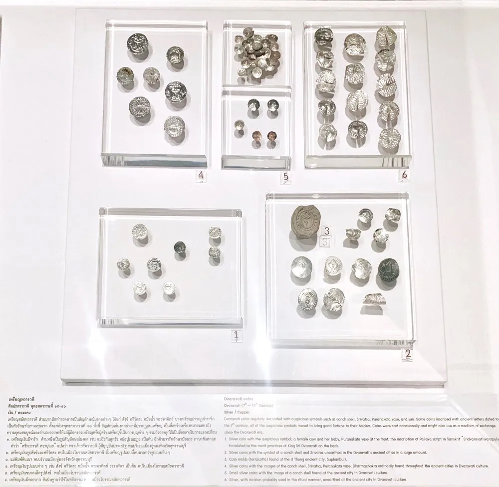 Silver and copper coins from the Dvaravati period on display at the National Museum Bangkok