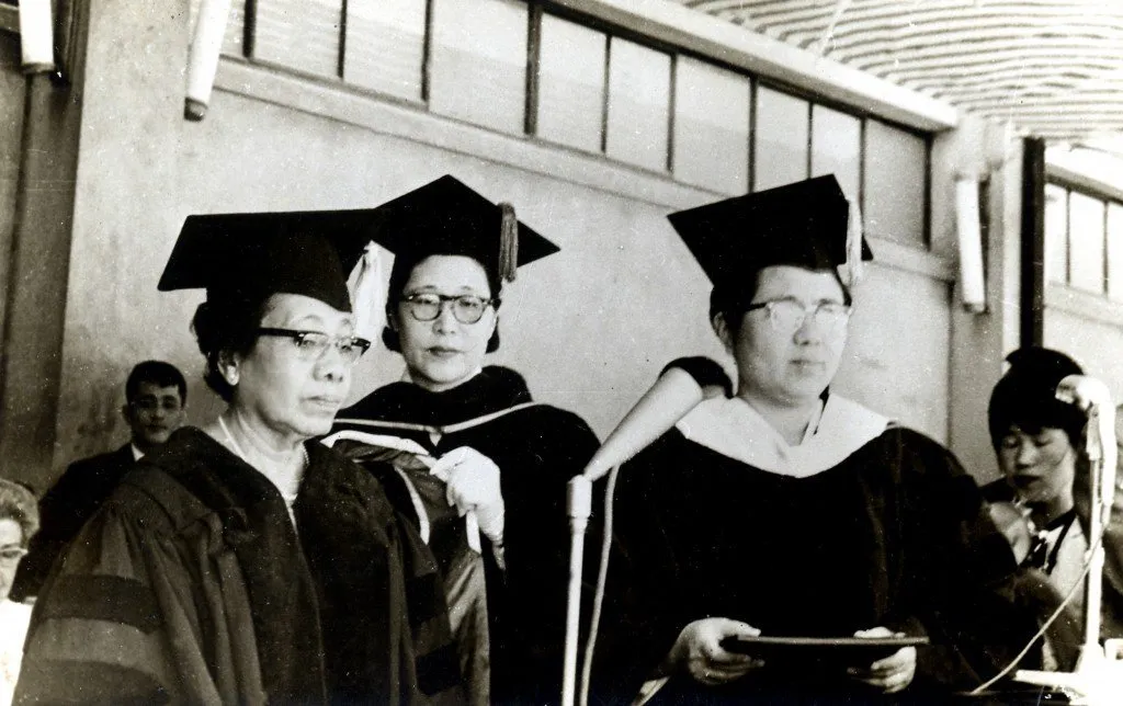 Dr Pierra with other alumni at a graduation ceremony