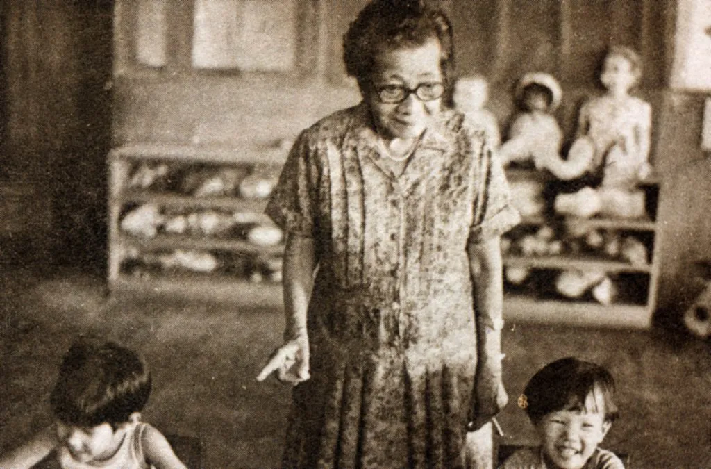Dr Pierra teaching children in a classroom at her orphanage