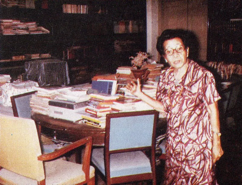 Dr Pierra standing next to her working desk