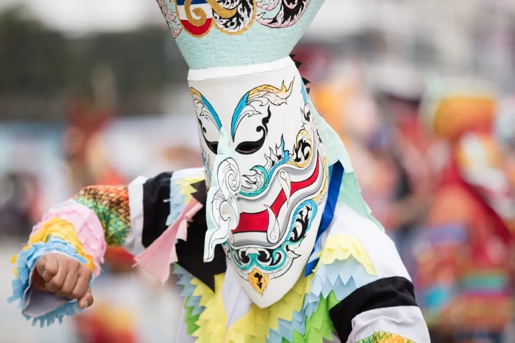 Local people in Loei province wearing a traditional ghost mask at Phi Ta Khon Festival