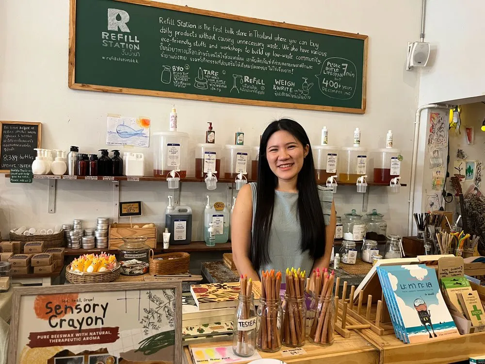 Pear Papawee standing in front of the refill station