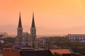 church building in front of sunset