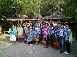 a group of tourists with tie dye scarfs