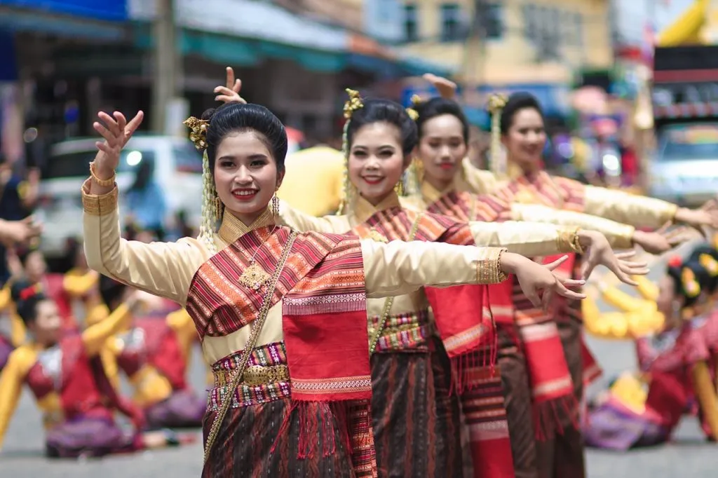 Locals in traditional Thai dresses at Ubon Ratchathani Candle Festival