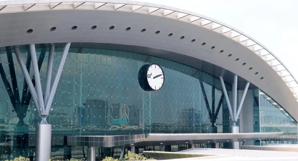 Bang Sue Grand Station entrance features a large clock with only the Thai number 9, and bright lights to welcome you into the glass building.