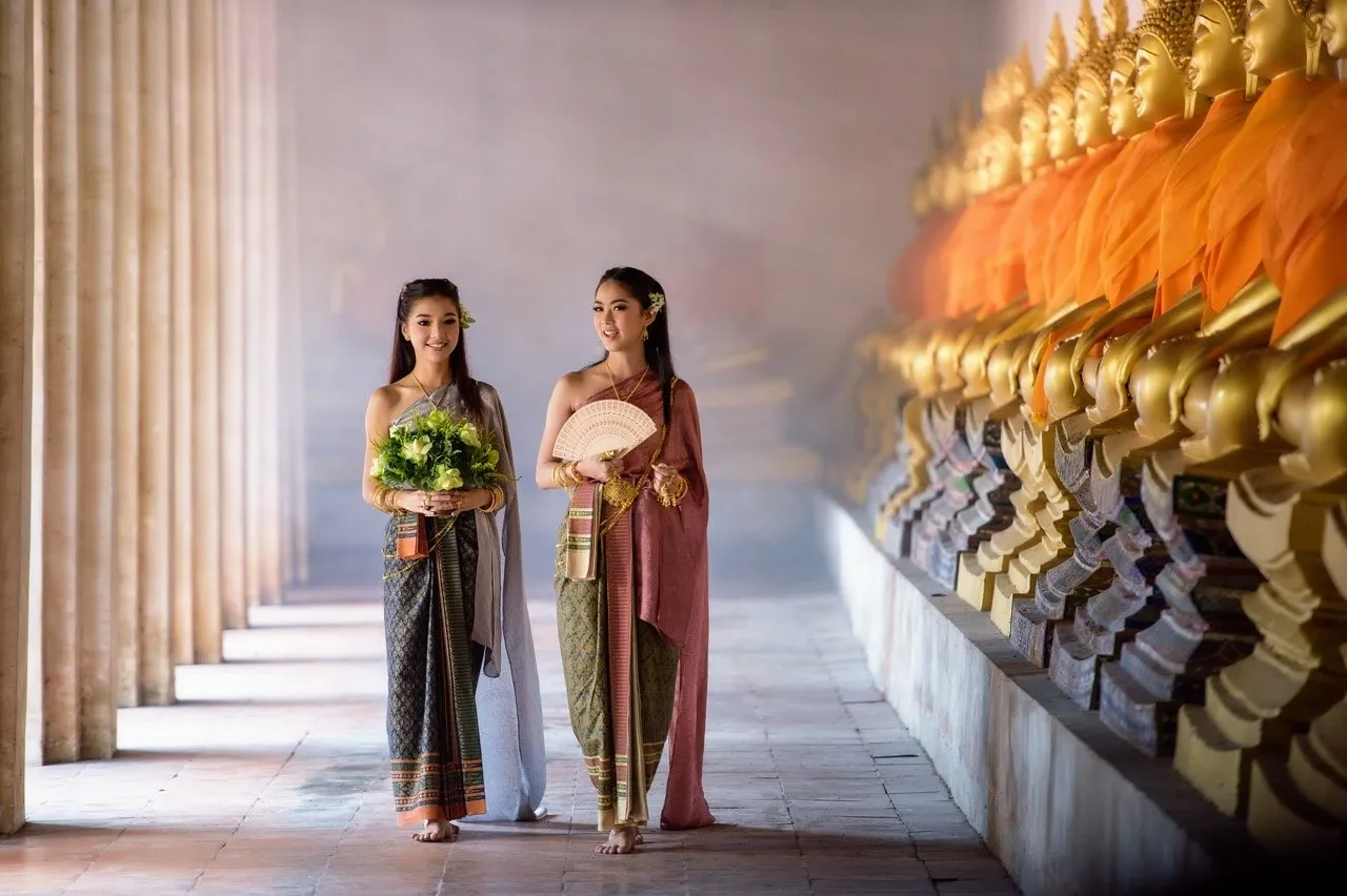 Thai women in Thai traditional dresses at a temple
