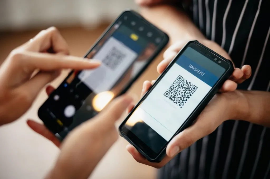 A customer using QR code payment to pay