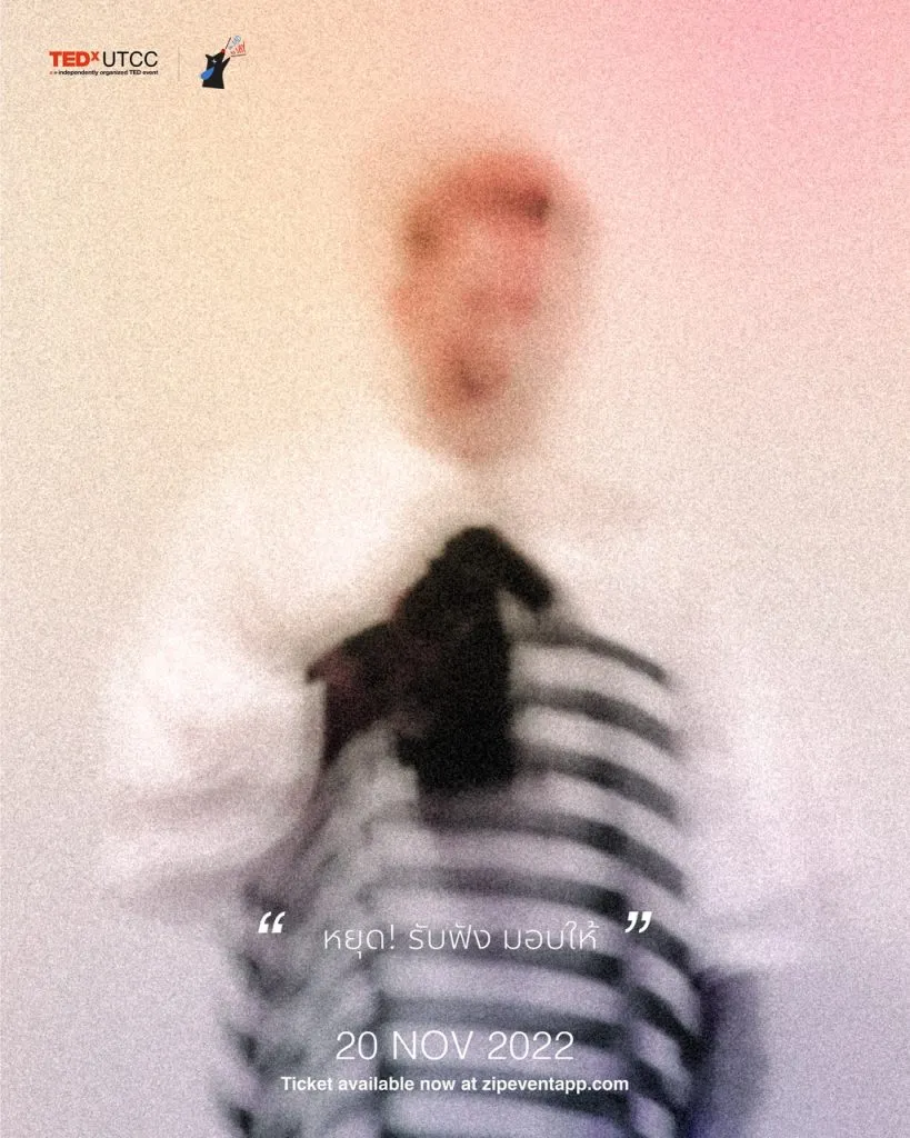 An out of focus picture of the second speaker with the hint of "stop! listen and give"