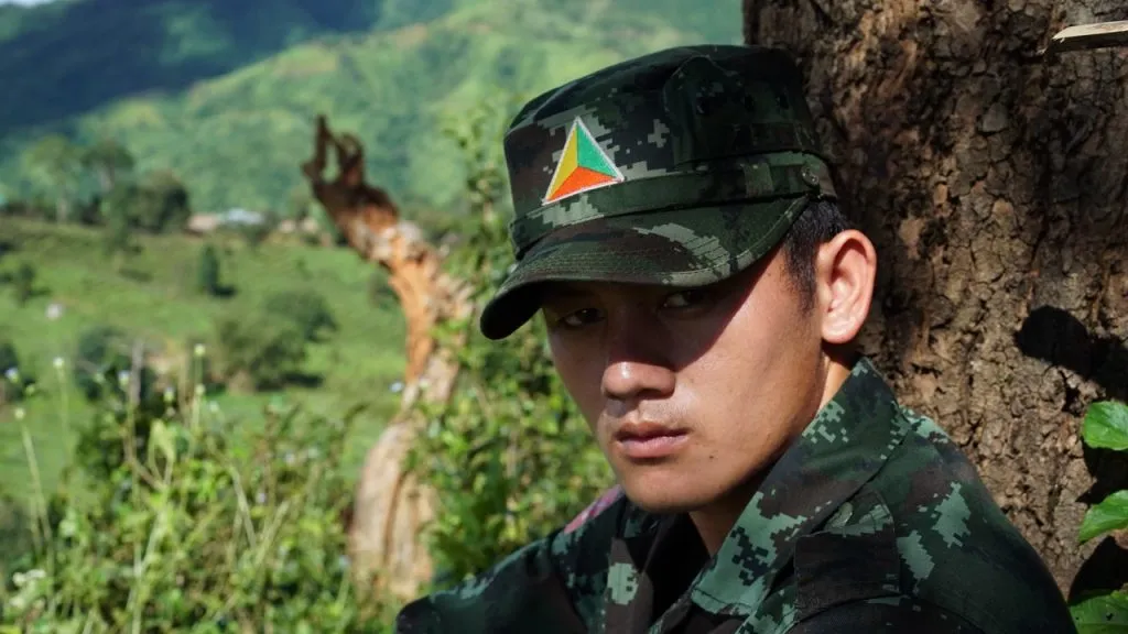 A scene of the main character from Soil Without Land, Komtouch's documentary, follows a Shan man navigating the loss of his family and joining the Shan State Army.