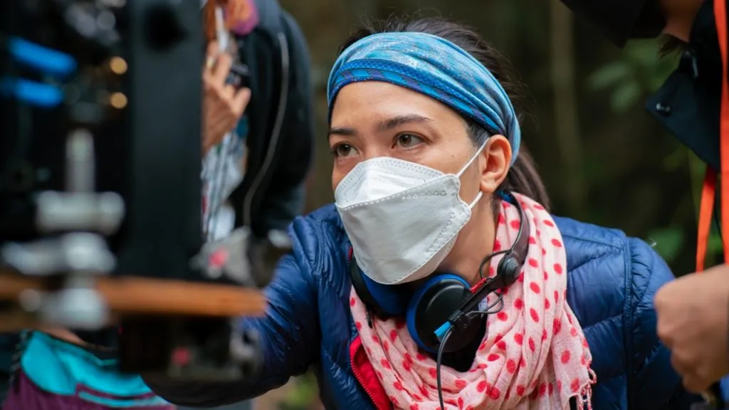 Pailin working behind the camera on the set of The Trapped 13