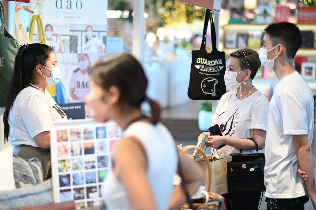 Customers purchasing Dao Ethical Gifts' products at an event