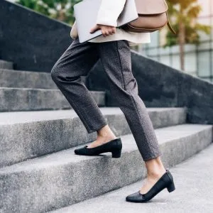 A businesswoman walking up the stairs