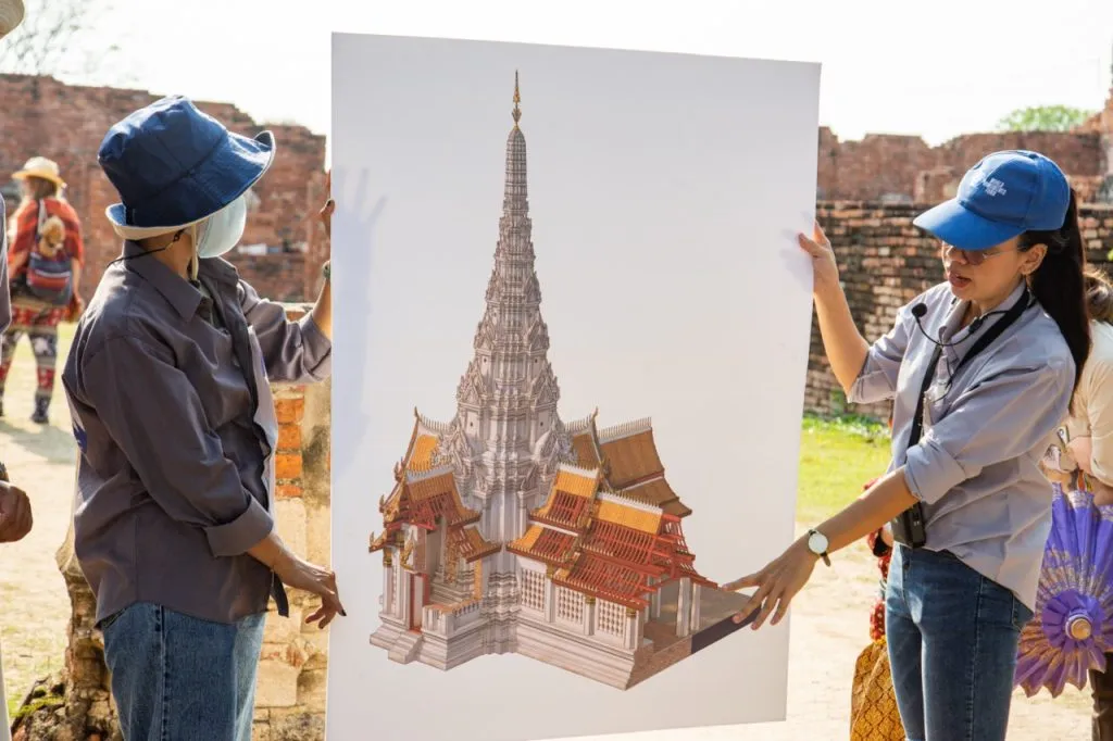 Ms. Waraporn Suwatchotikul (right) unveils the visual reconstruction of a meru and part of the covered gallery, Wat Chaiwatthanaram. The reconstruction was created by Patcharapong Kulkanchanachewin and published on Facebook (arch.kidyang) on 28 February 2023, and on Twitter @arch_kidyang, on 2 March 2023