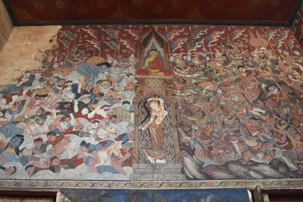 Maravijaya mural above the front doors of the ordination hall at Wat Bang Yi Khan