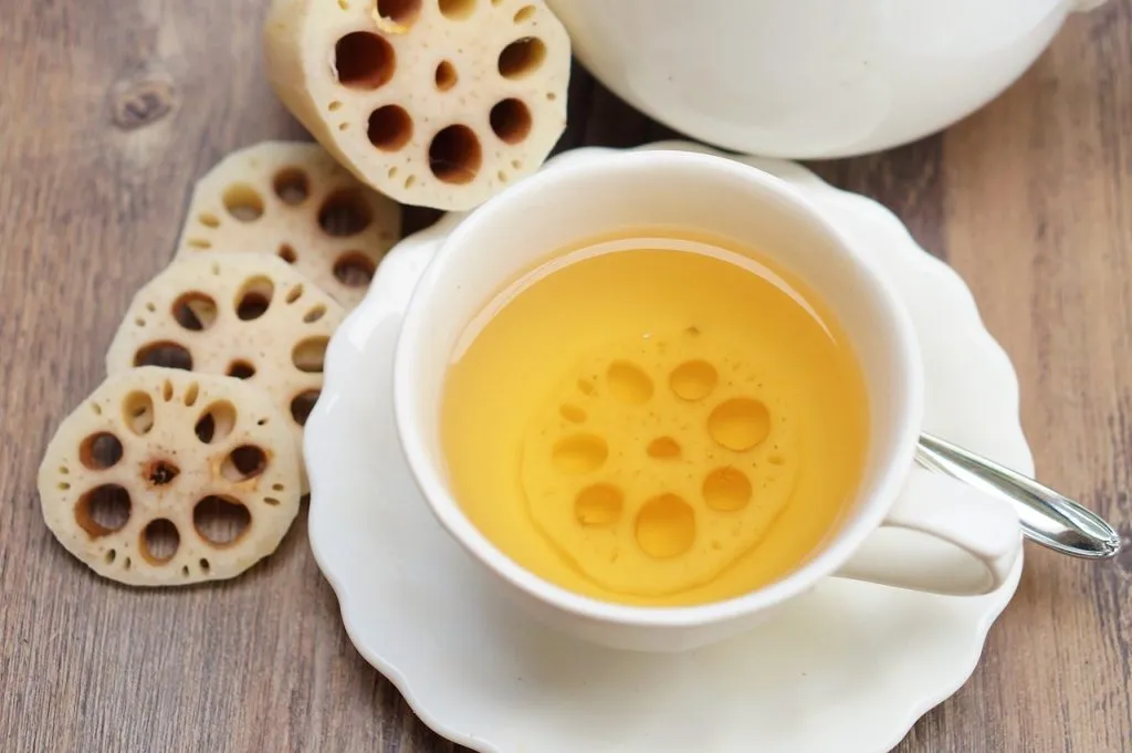 A lotus root drink with a slice of lotus root