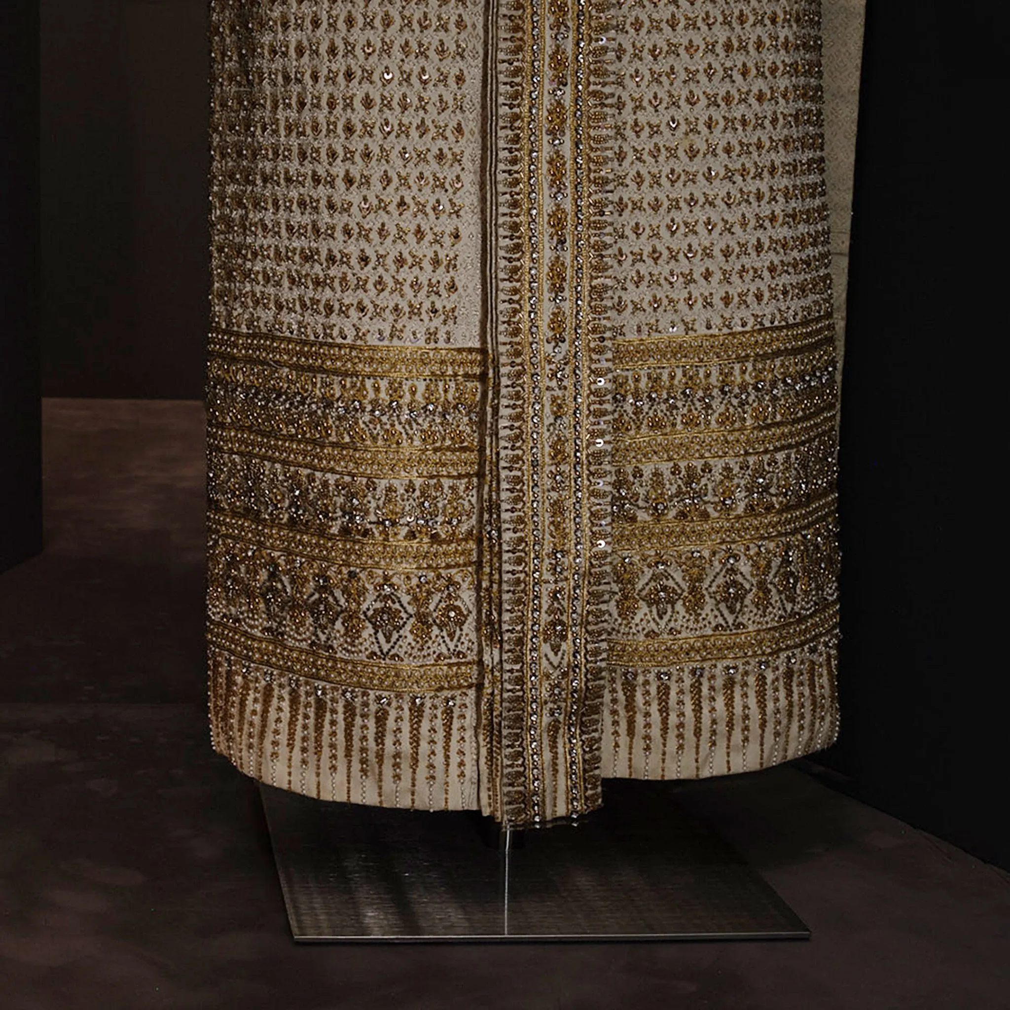 A close-up shot of the Siwalai dress with gold detailing