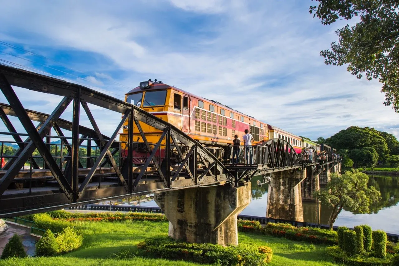 River Kwai Bridge with active train running in Kanchanaburi province, Thailand