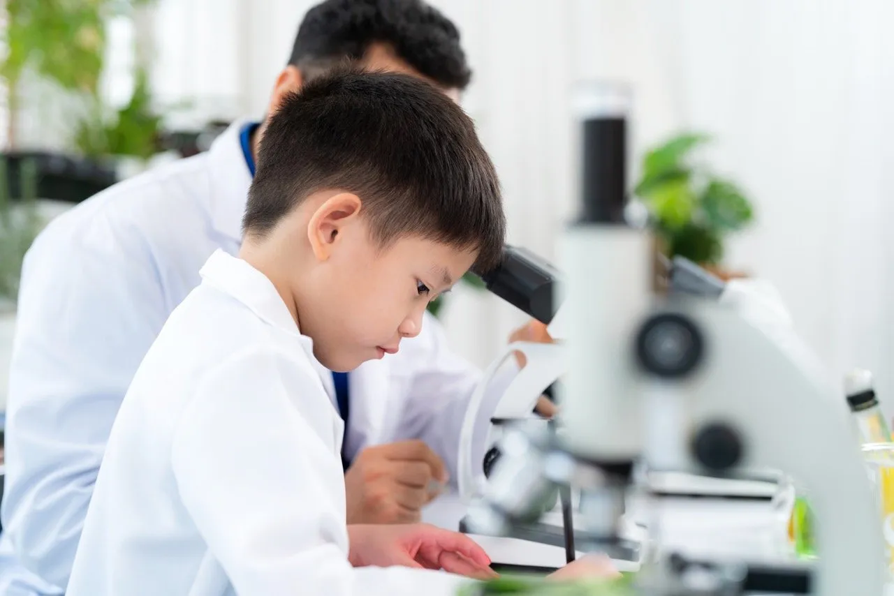 A young boy doing a science homework