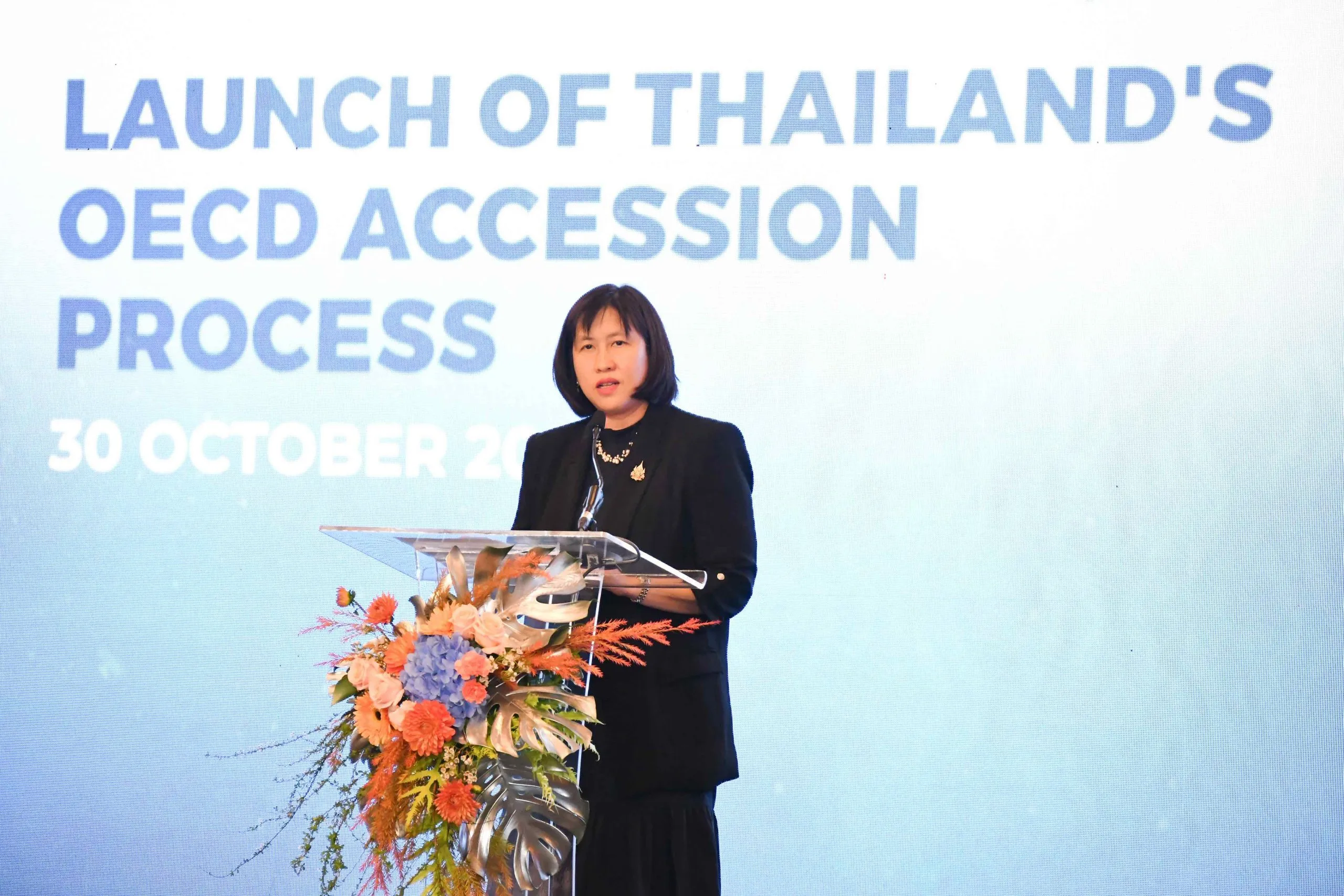 Acting Director General of the MFA Department of International Economic Affairs Rujikorn Saengchantr delivering welcoming remarks at the launch ceremony of Thailand OECD accession process.