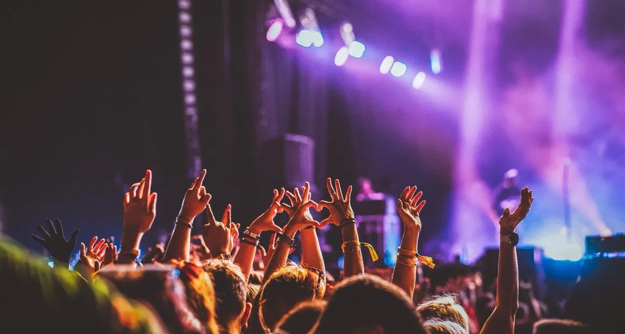 A crowd partying at a music festival