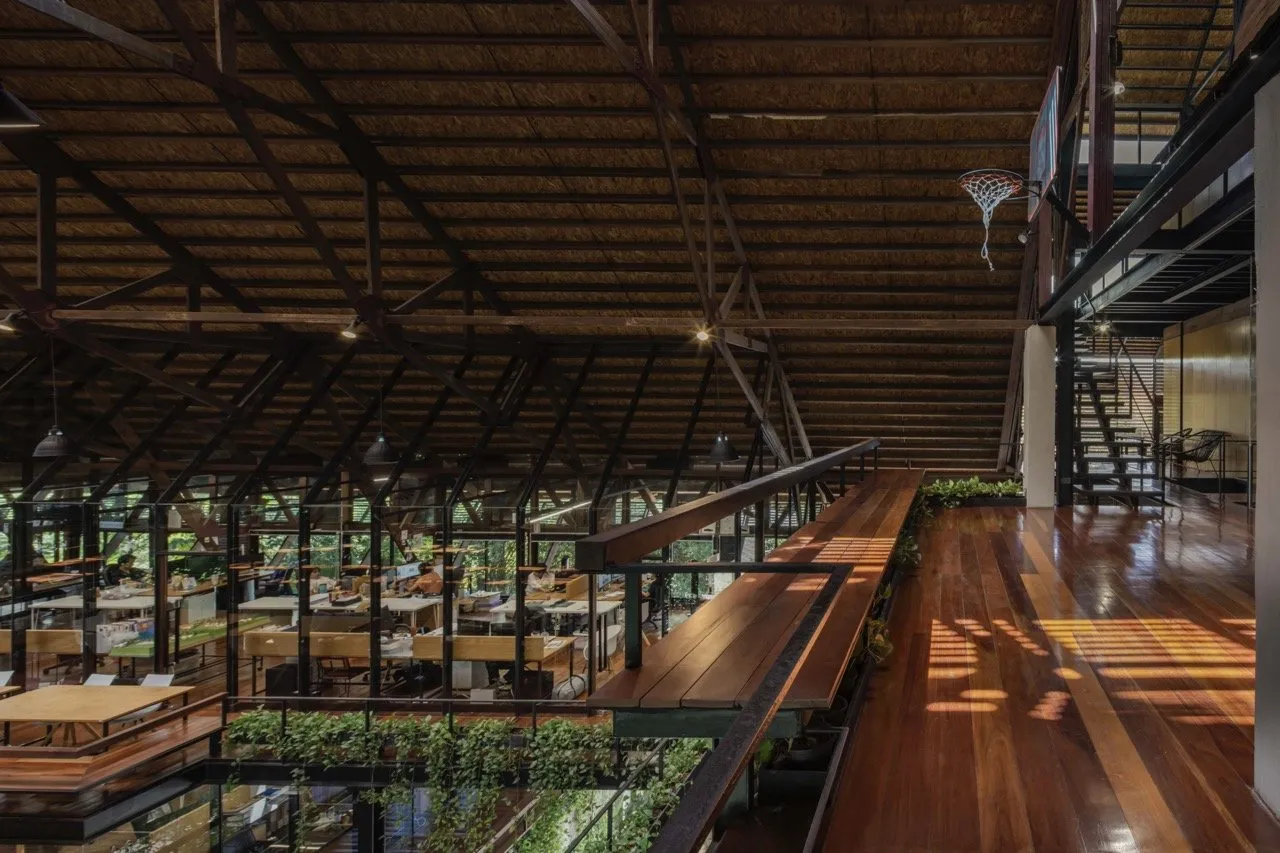 Exterior shot of the Rabhindorn Building with hanging planters that seamlessly transition to adjacent trees and vegetation