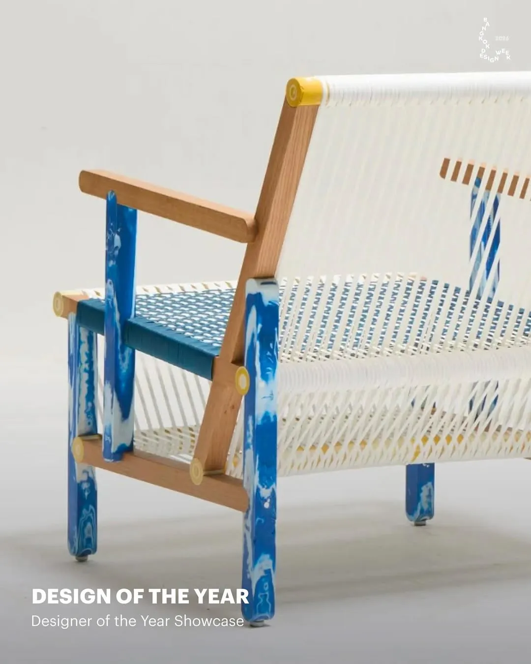 BKKDW2026 activity depicting a minimal wooden chair with an intricate woven mesh