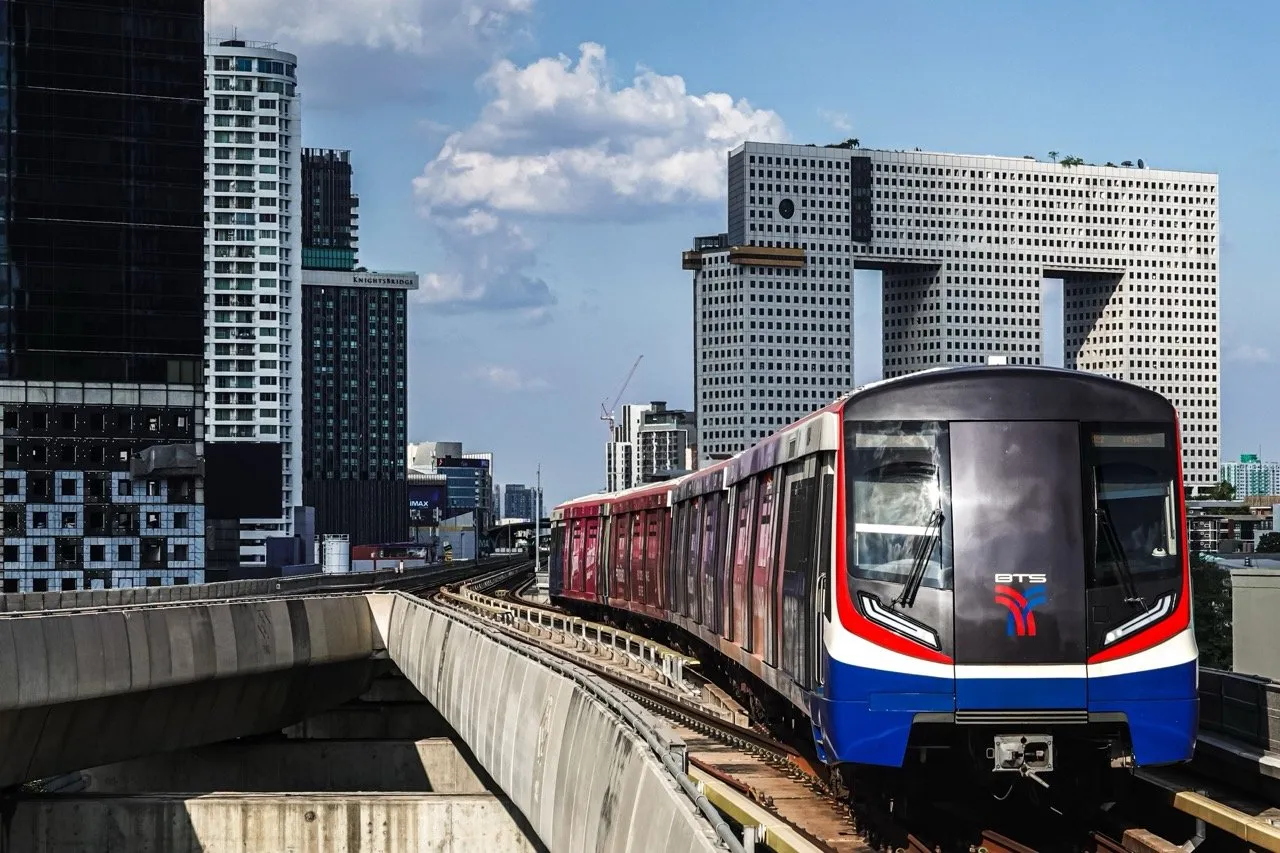 BTS Skytrain Thailand running past the Chang Building