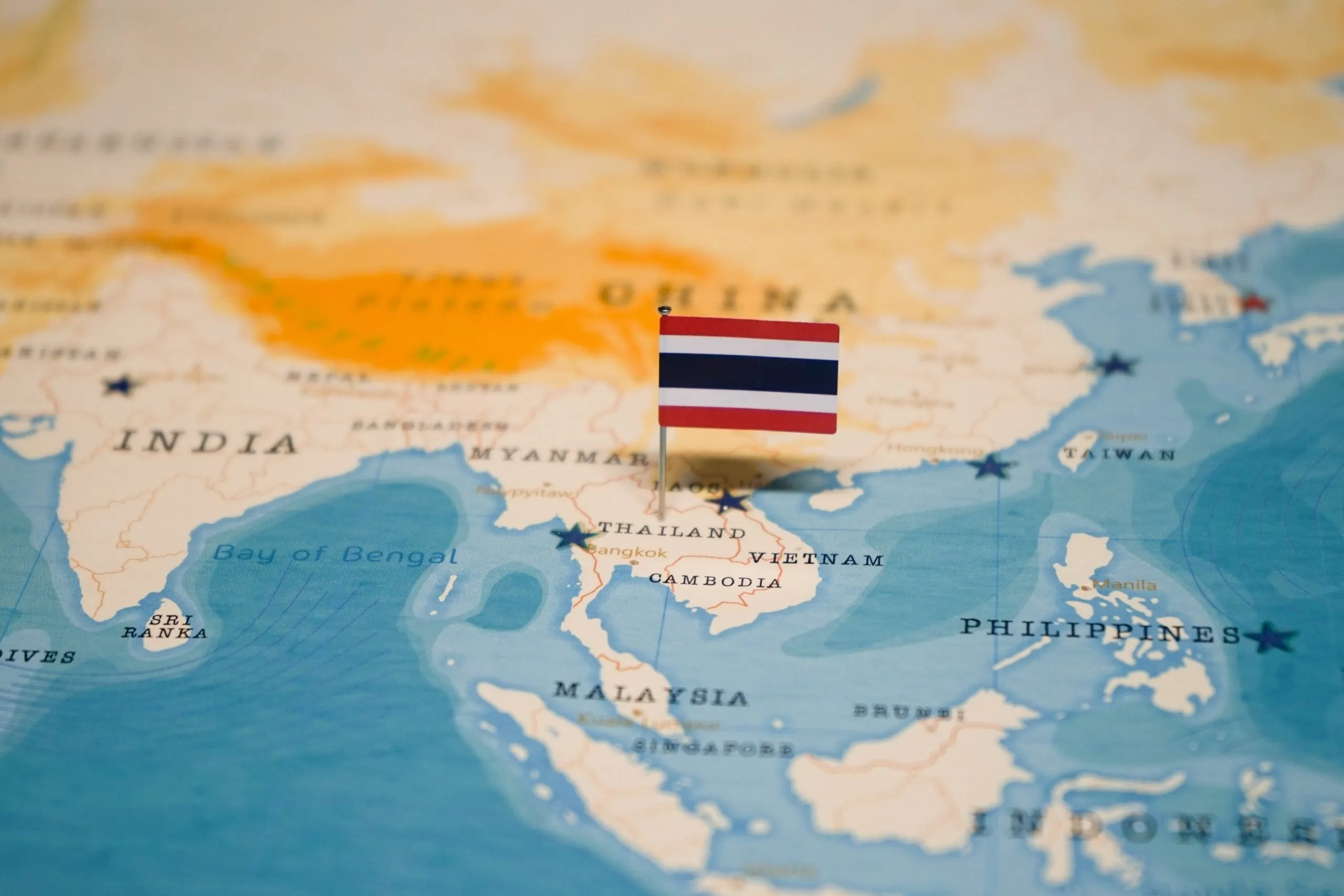 Map of Thailand with Thai flag pinned over Thailand