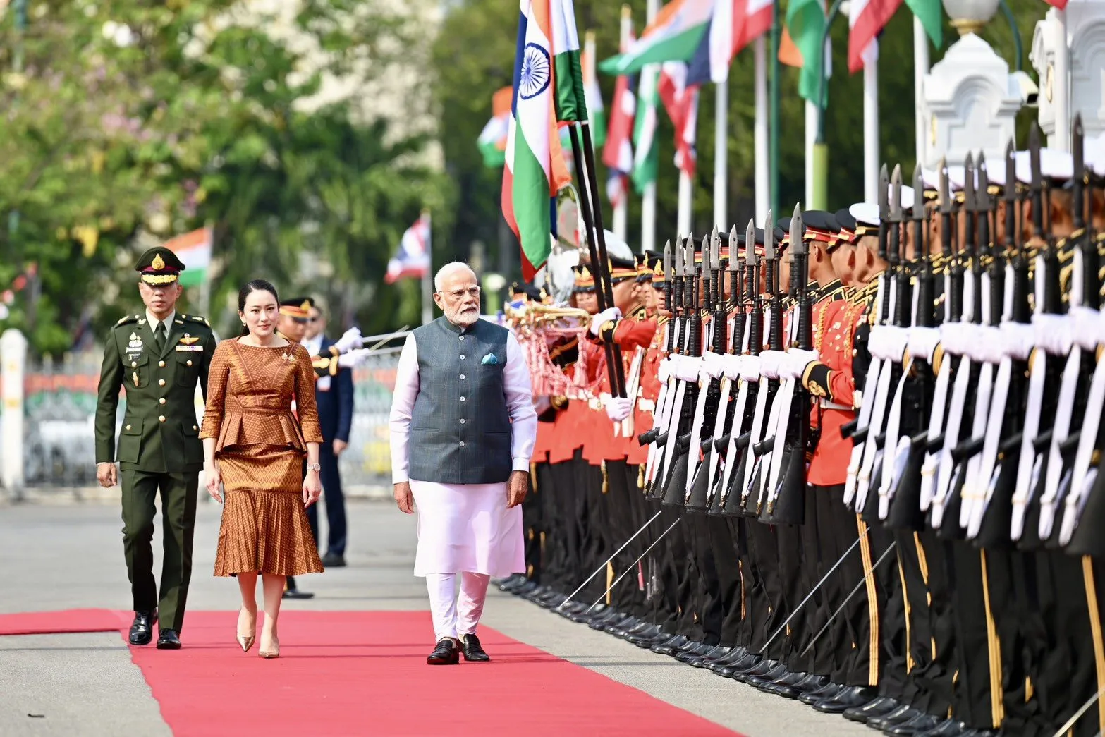 Thailand Prime Minister Paetongtarn Shinawatra and India Prime Minister Narendra Modi inspecting the Guard Of Honour at the ceremonial welcome to Thailand